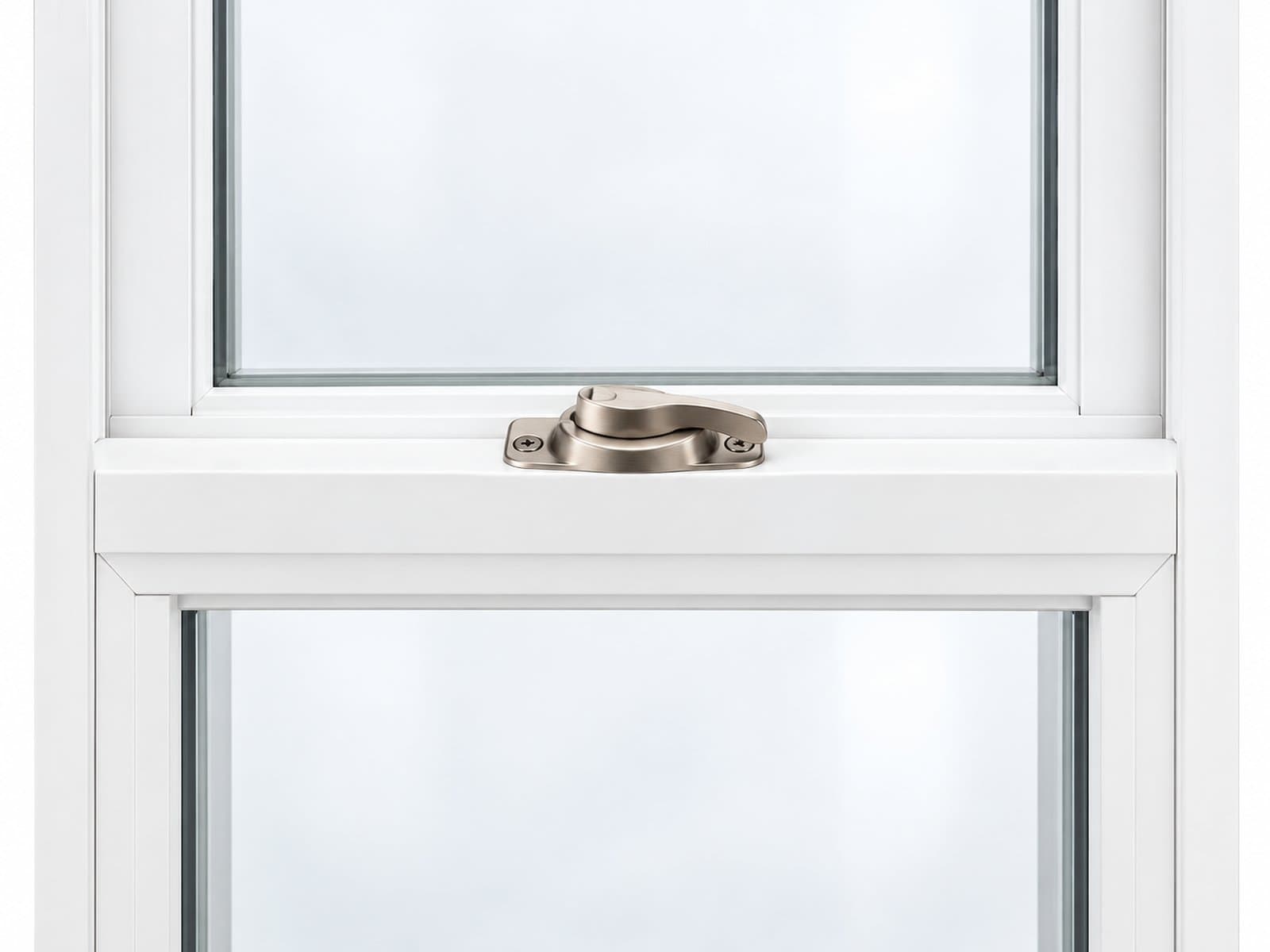 A satin-nickel cam lock secures two white window meeting rails.